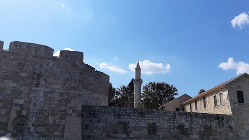 The iconic Royal Walls of Ceuta standing firm against a bright blue sky.