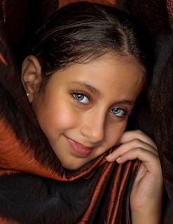 woman in black and orange scarf