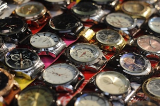 a bunch of watches sitting on top of each other