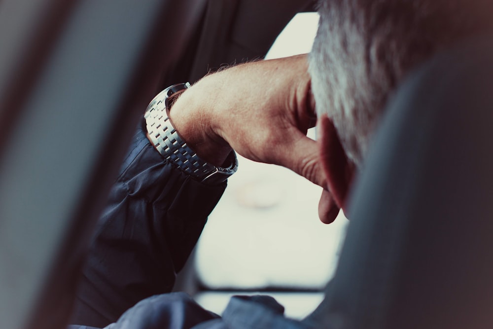 person wearing silver and gold bracelet