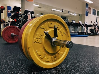 yellow and black dumbbell on black table