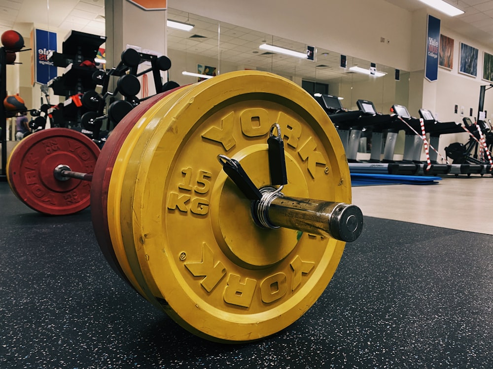 yellow and black dumbbell on black table