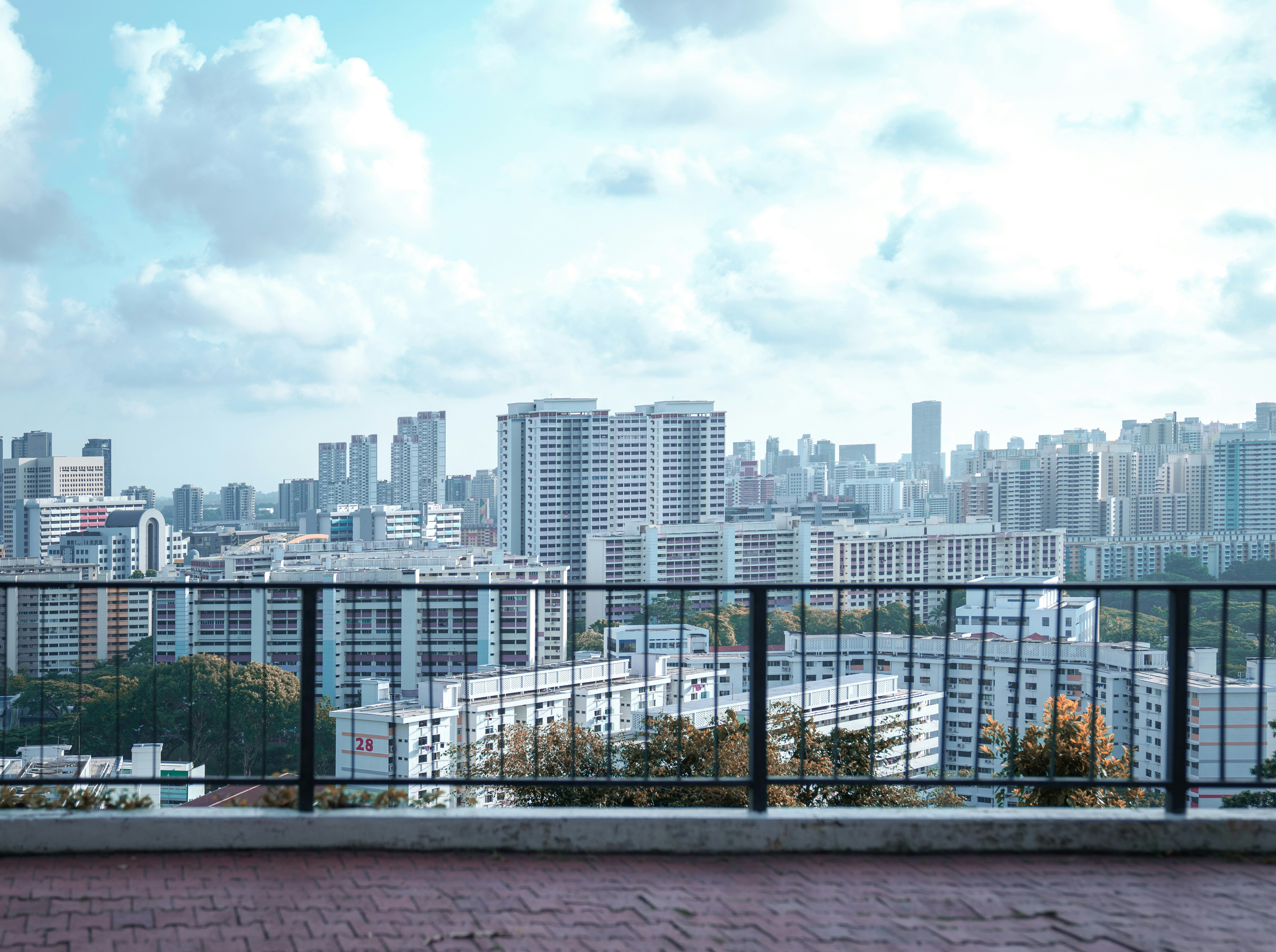 city skyline under white cloudy sky during daytime