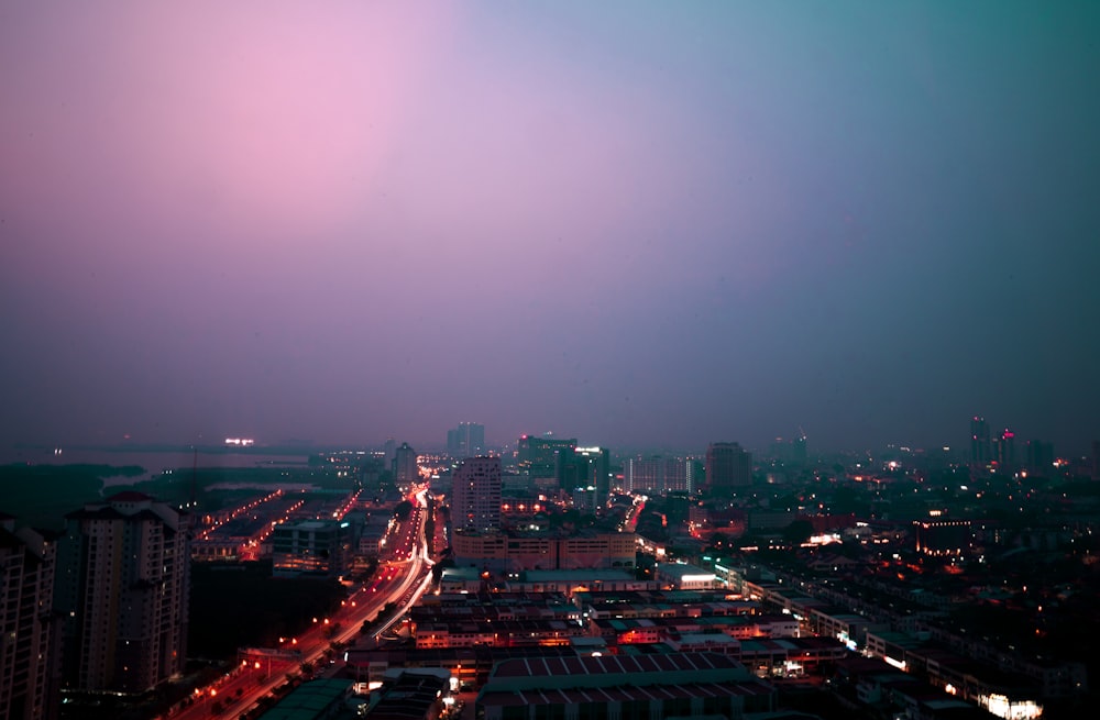 city with high rise buildings during night time