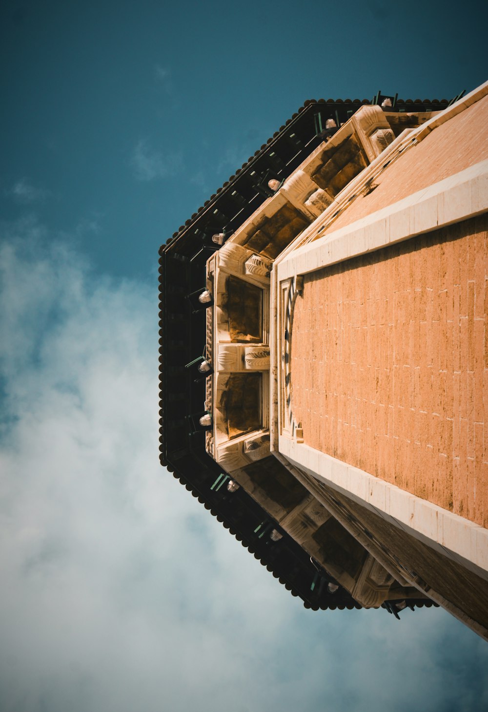 brown concrete building under blue sky during daytime