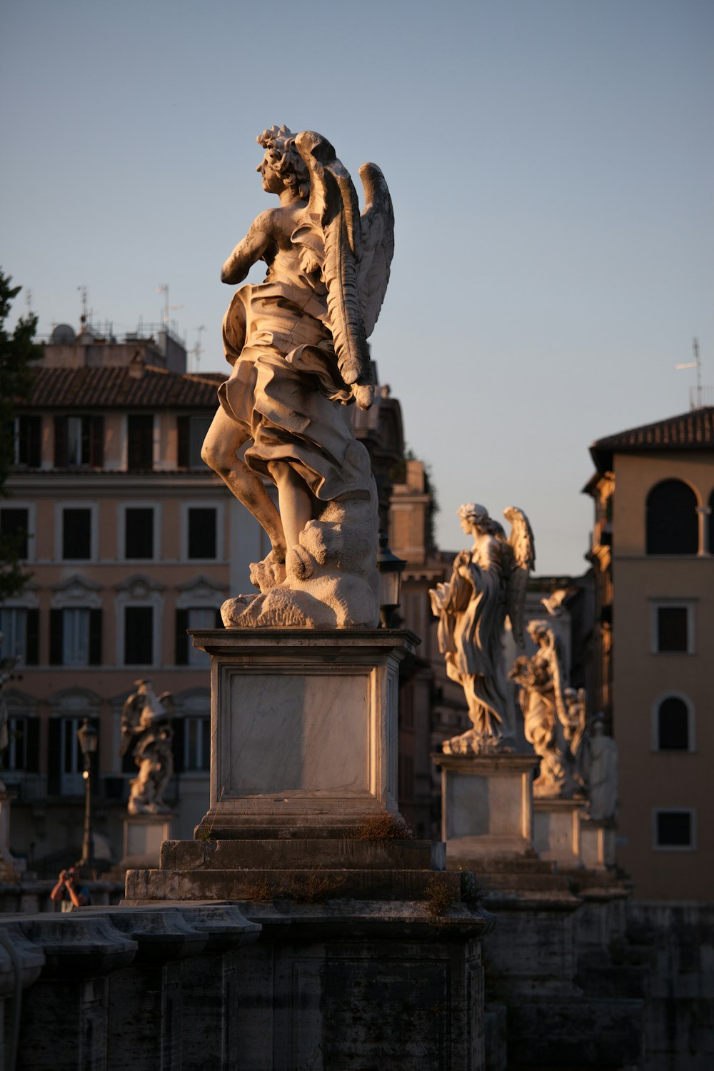 gold statue of man and woman