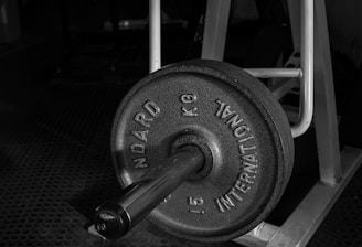 black and gray dumbbell on black textile