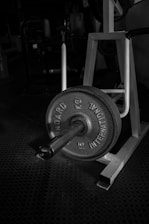 black and gray dumbbell on black textile