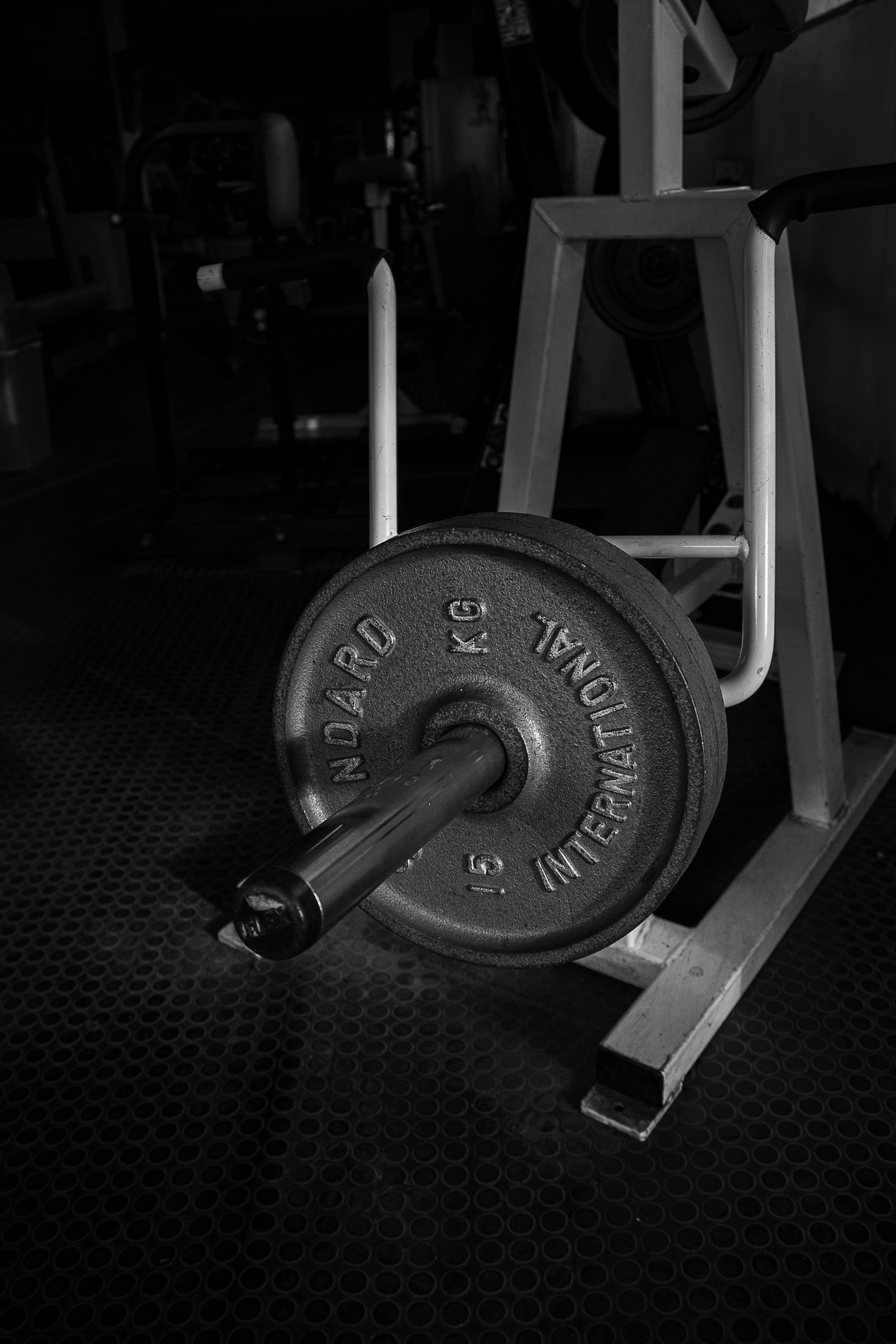 black and gray dumbbell on black textile