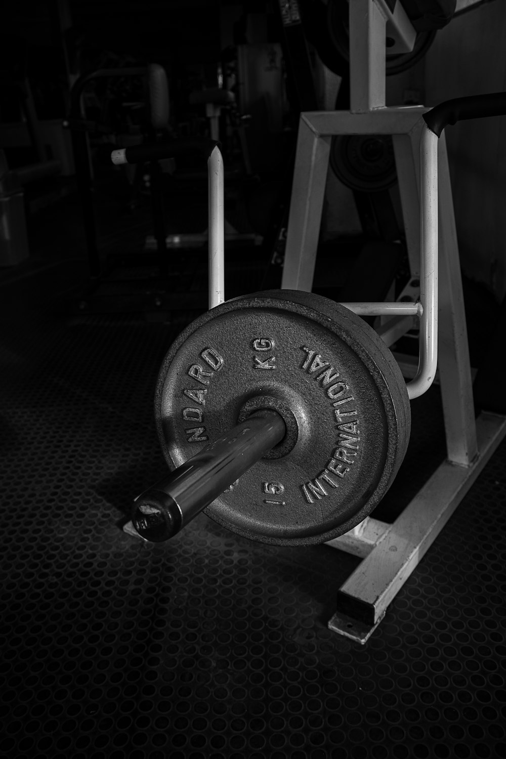 black and gray dumbbell on black textile