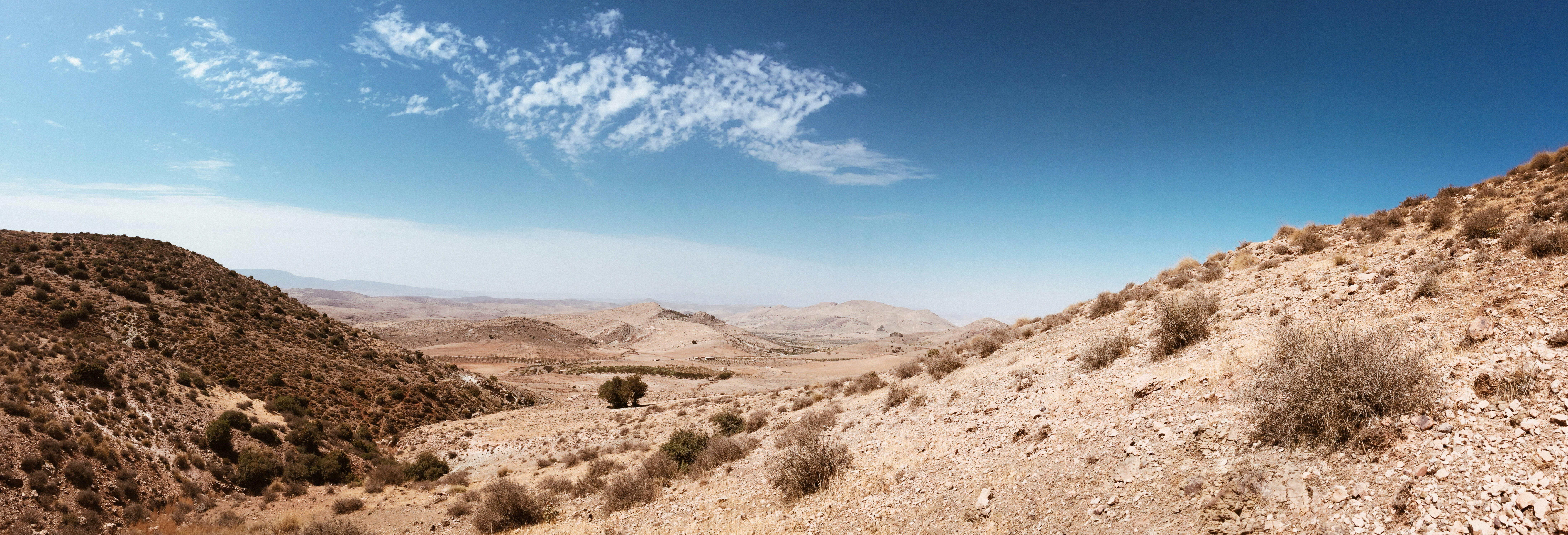 Brown mountain under blue sky during daytime