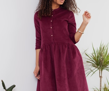 woman in red long sleeve dress