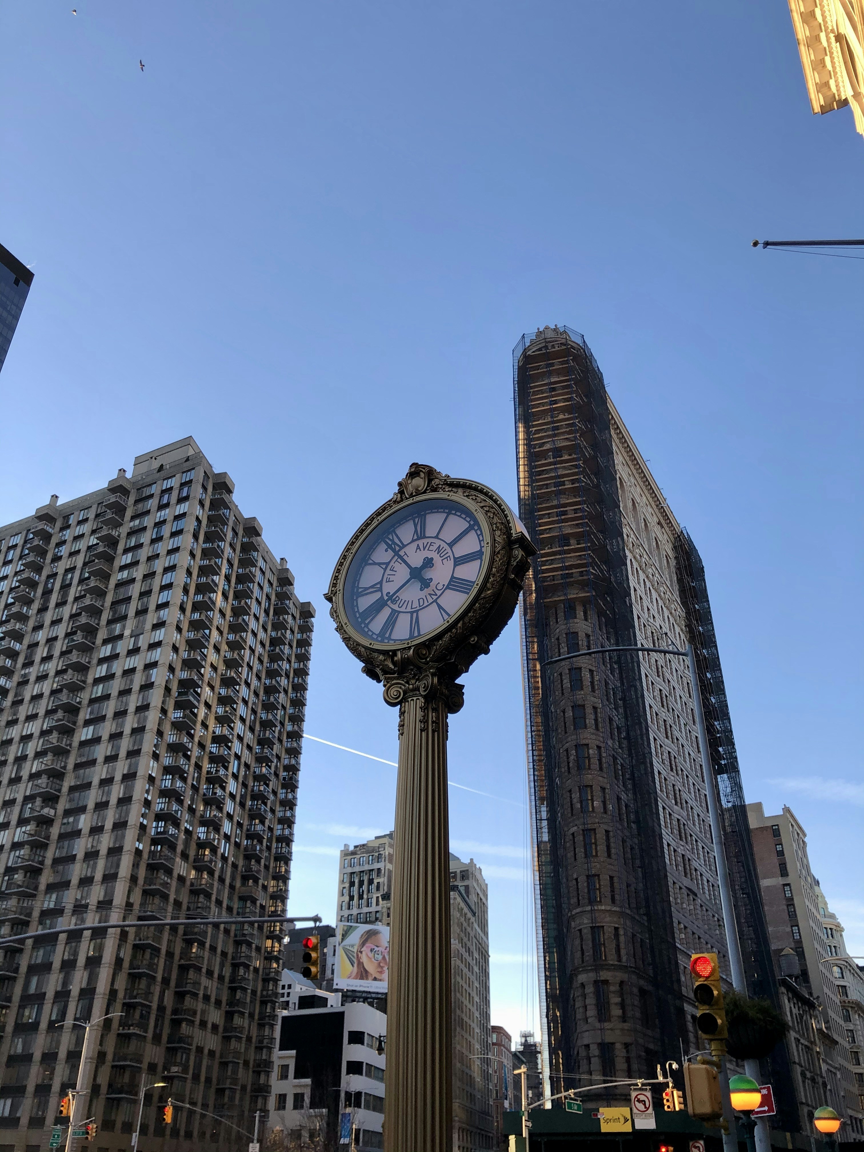 white and black analog clock at 11 00