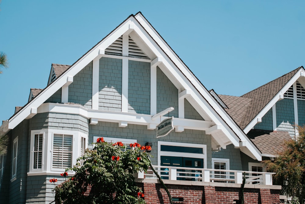 white and brown wooden house under blue sky during daytime