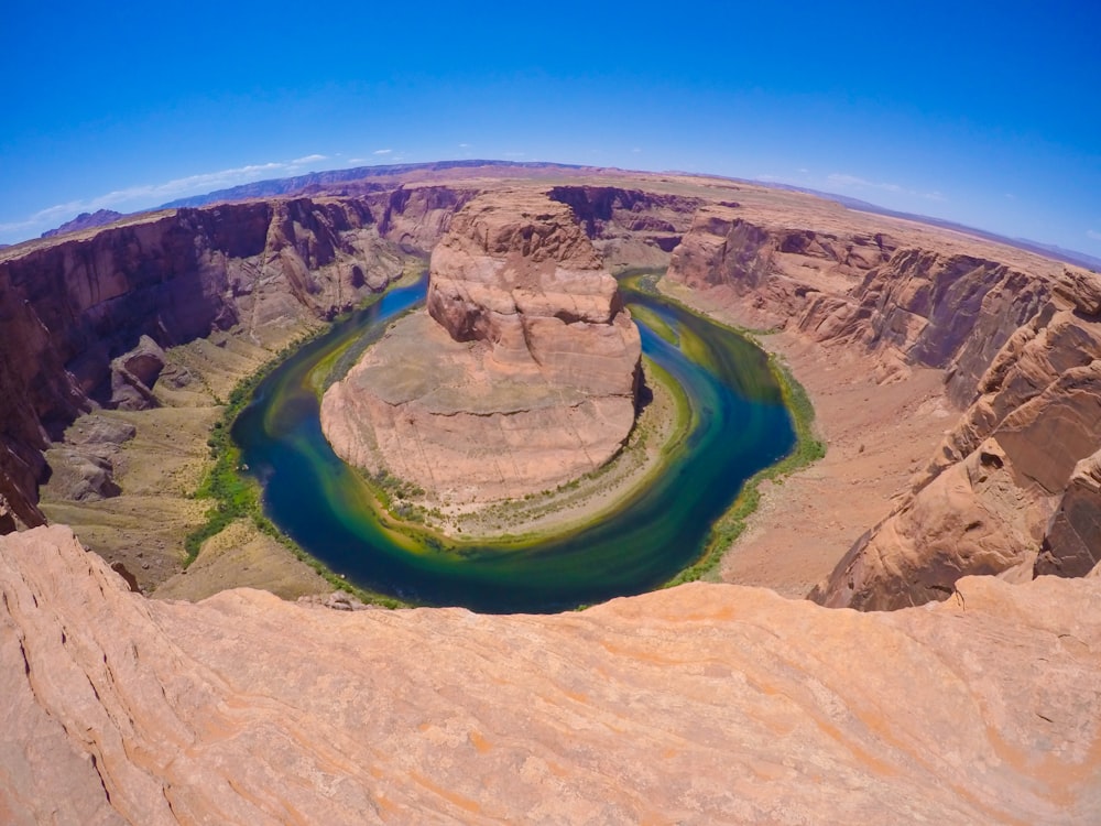 brown rock formation under blue sky during daytime