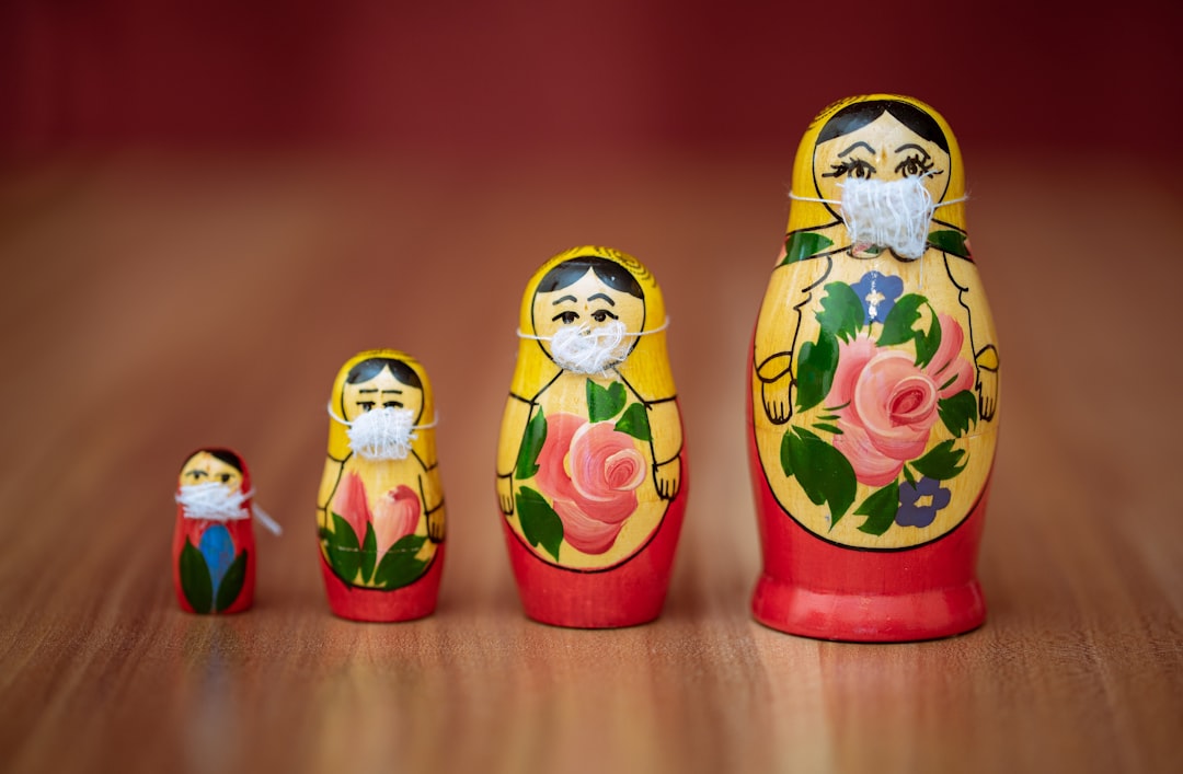 two red and yellow owl ceramic figurines