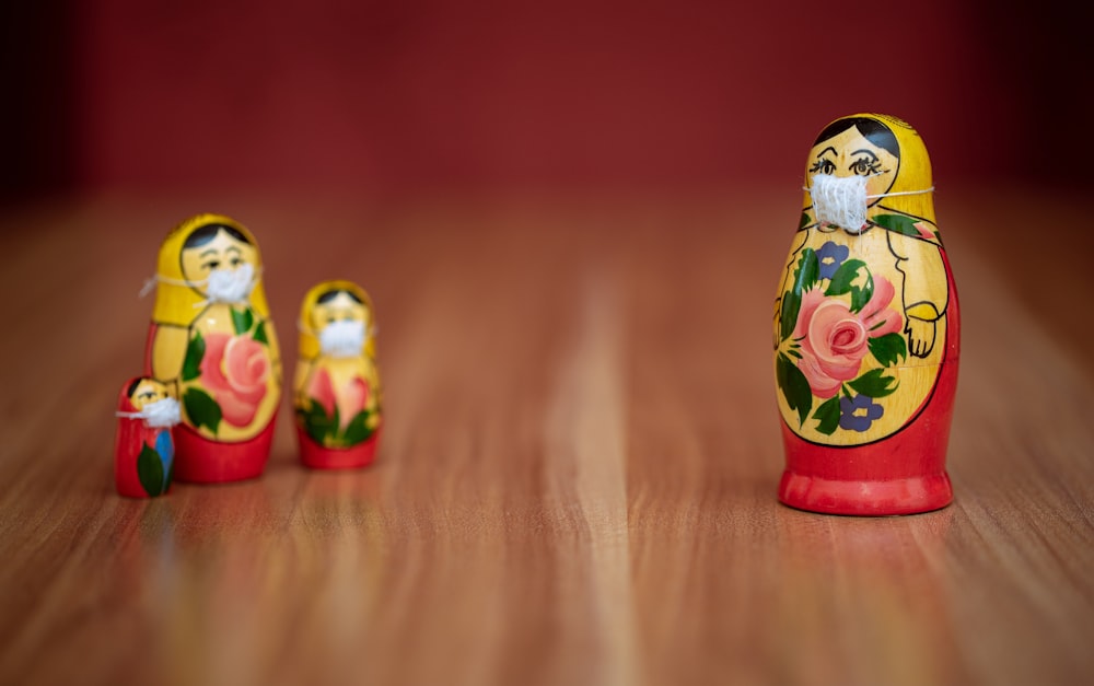 white red and yellow ceramic owl figurine