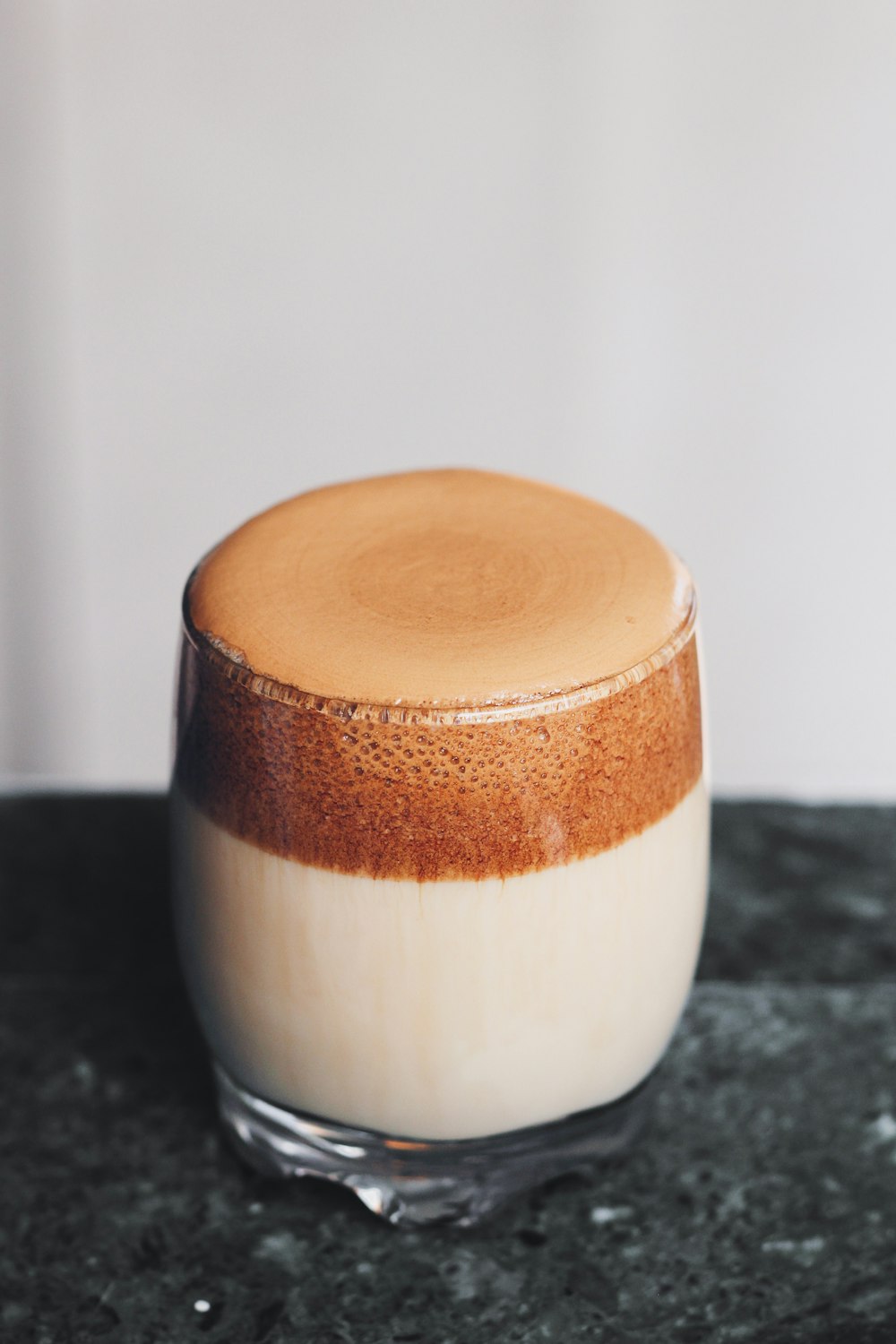 brown and white ceramic cup