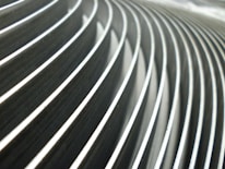 Close-up of symmetrical sharp lines and silver highlights forming an elegant business motif.