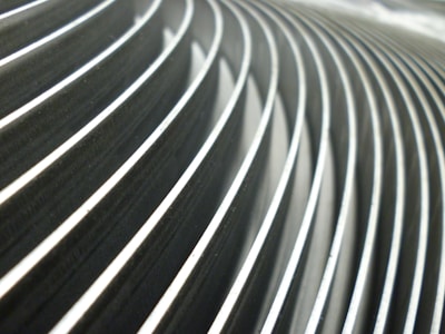 Close-up of symmetrical sharp lines and silver highlights forming an elegant business motif.