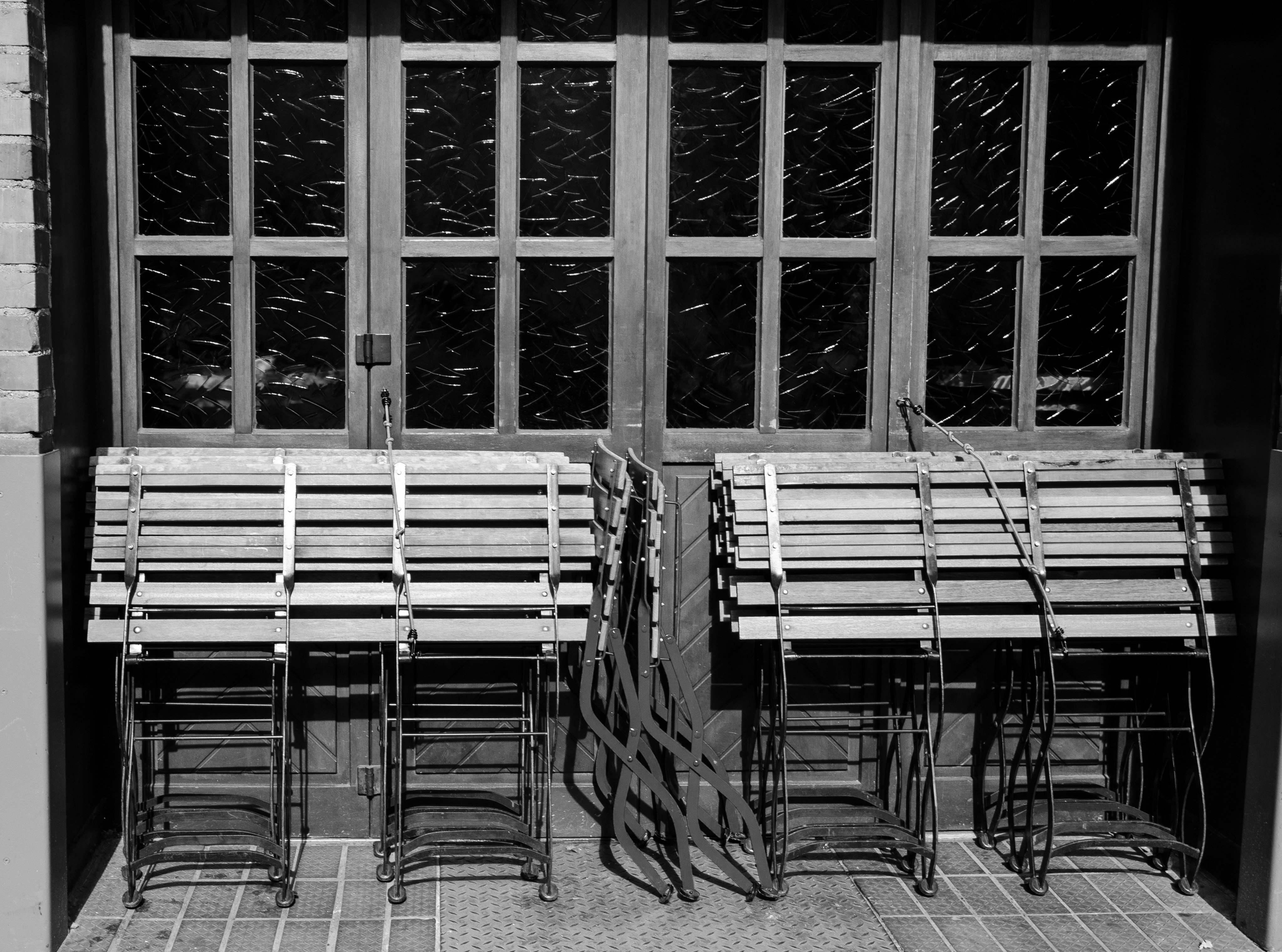 grayscale photo of chairs and tables