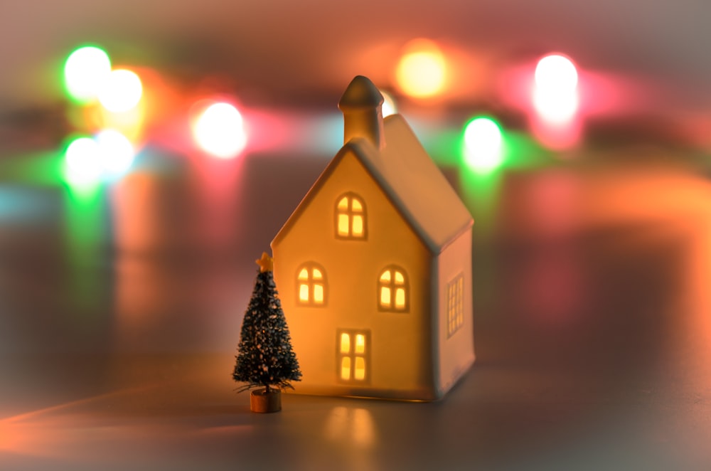 brown house miniature with christmas tree