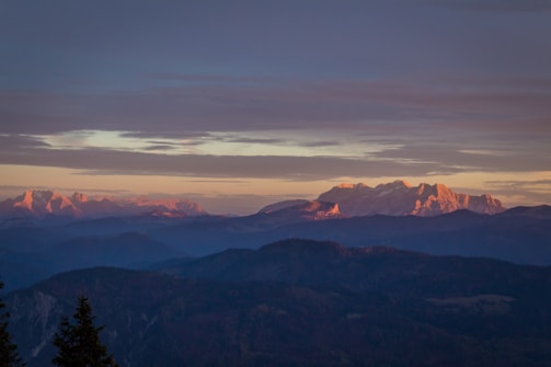 A distant mountain range bathed in golden sunset light.