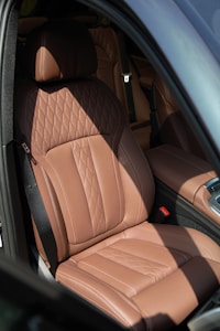 brown leather car seat in car