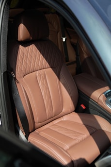 brown leather car seat in car