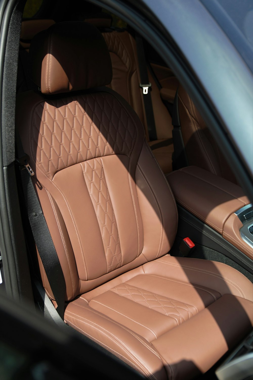 brown leather car seat in car