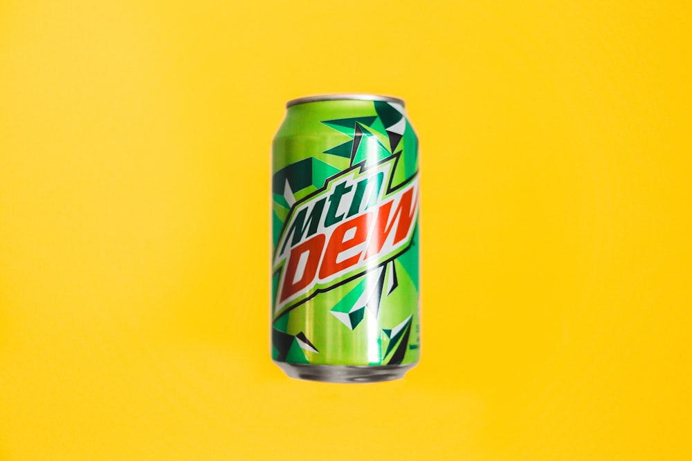 mountain dew can on yellow surface