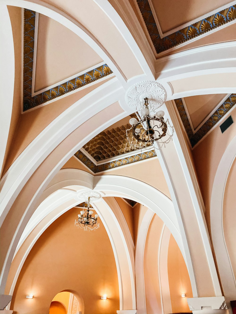 white and gold uplight chandelier