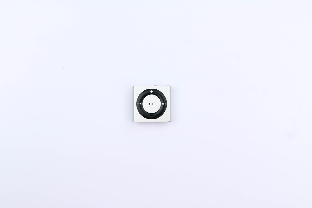 white and black round wall mounted device