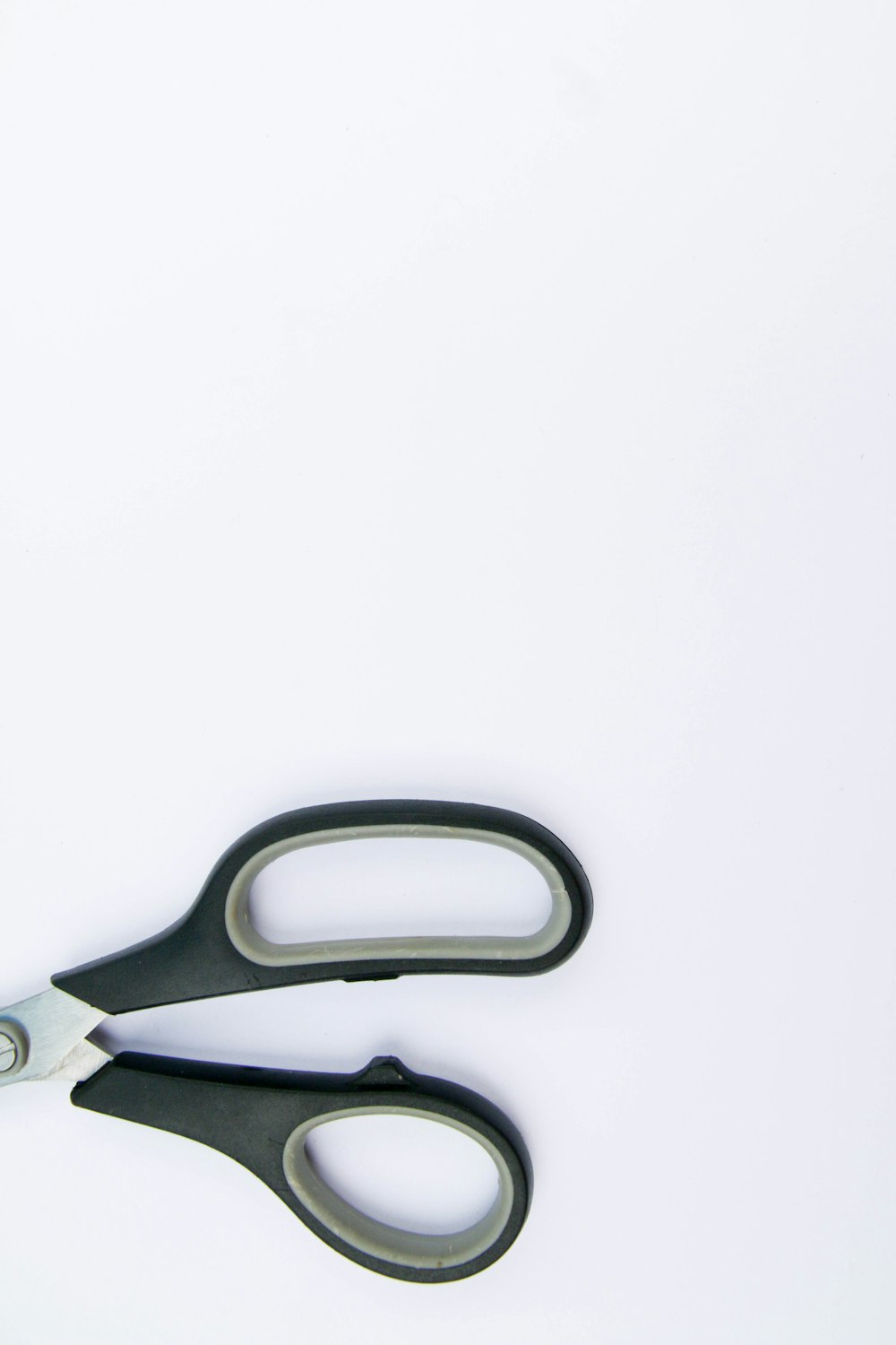 black and silver scissors on white surface