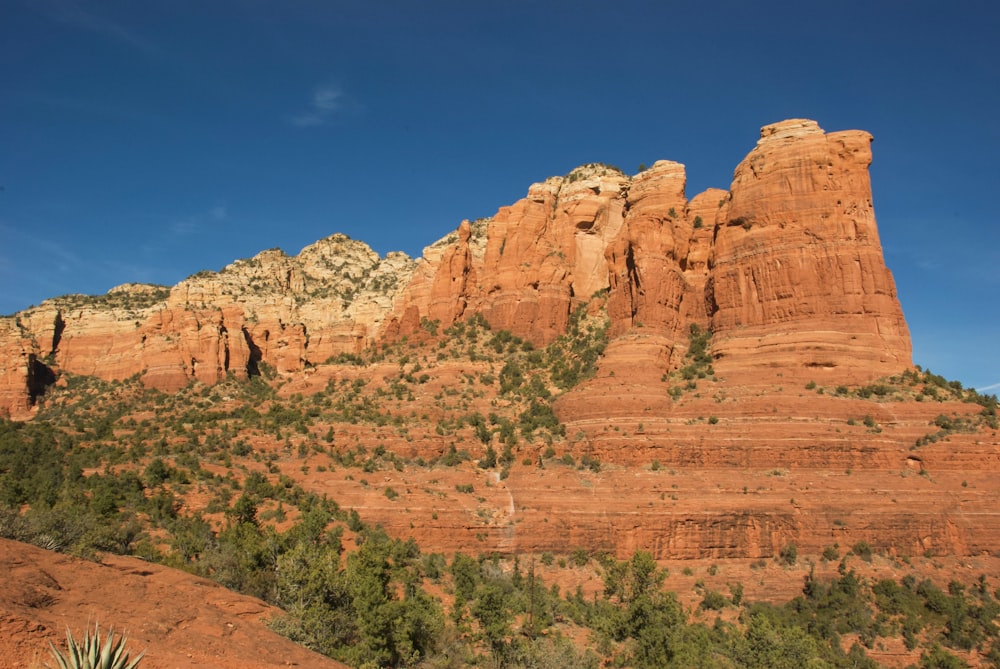 brown rock formation under blue sky during daytime