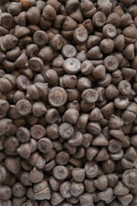 brown coffee beans on brown wooden surface