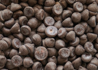 brown coffee beans on brown wooden surface