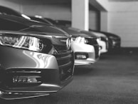 grayscale photo of car on road