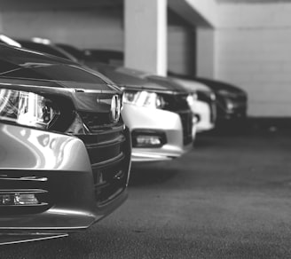 grayscale photo of car on road