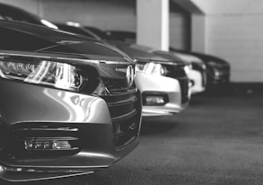 grayscale photo of car on road