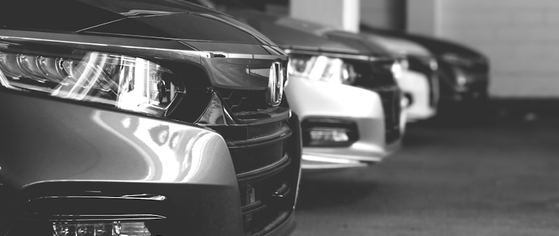 grayscale photo of car on road