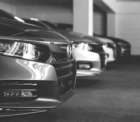 grayscale photo of car on road