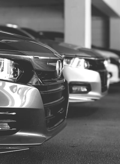 grayscale photo of car on road