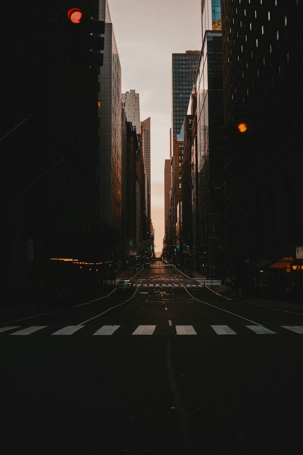 black and white pedestrian lane during night time