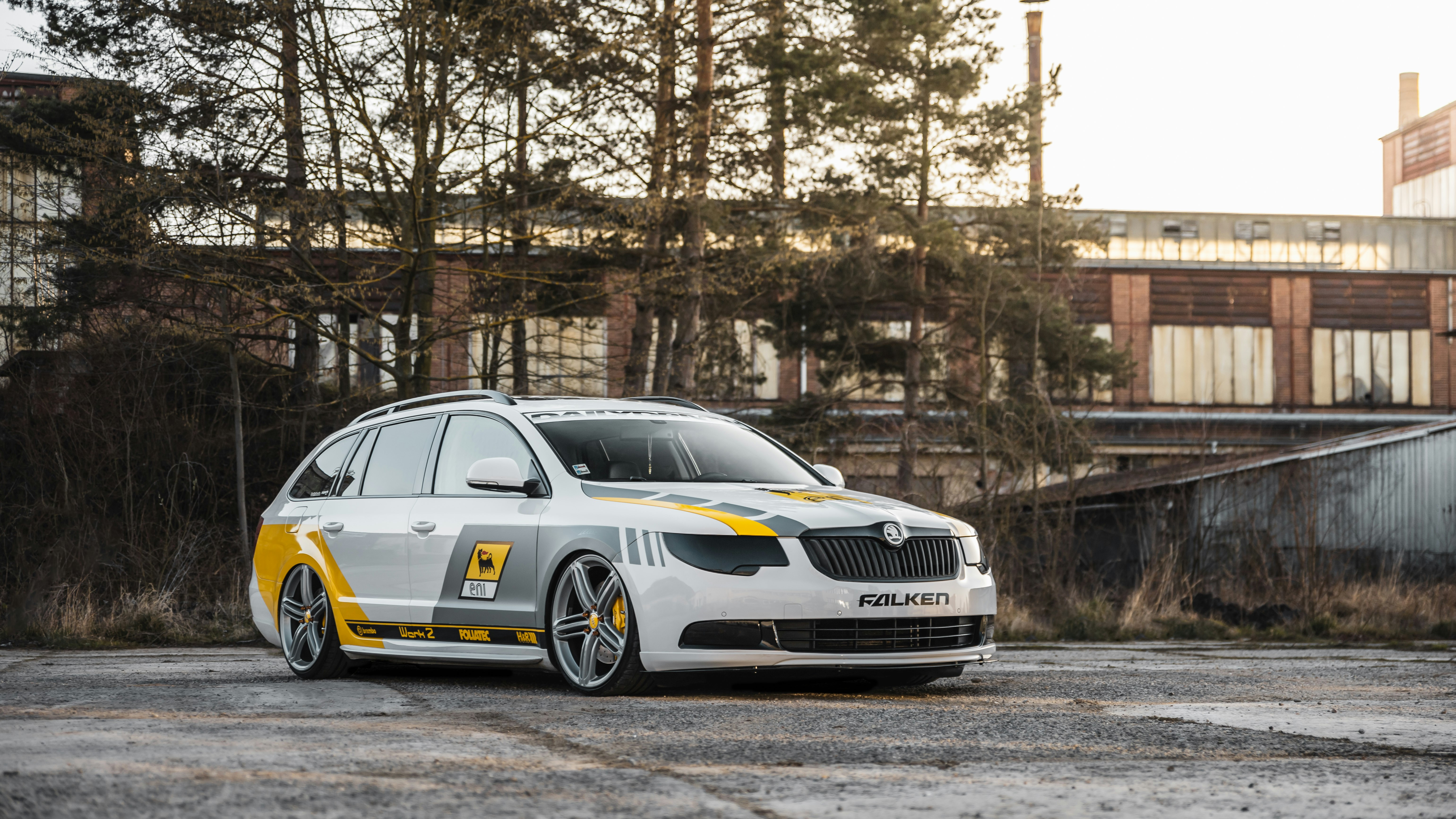 yellow and white bmw m 3 coupe parked on road during daytime