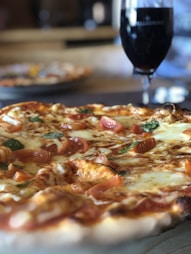 Close-up of a freshly baked Italian-style pizza with melted cheese and tomato sauce.