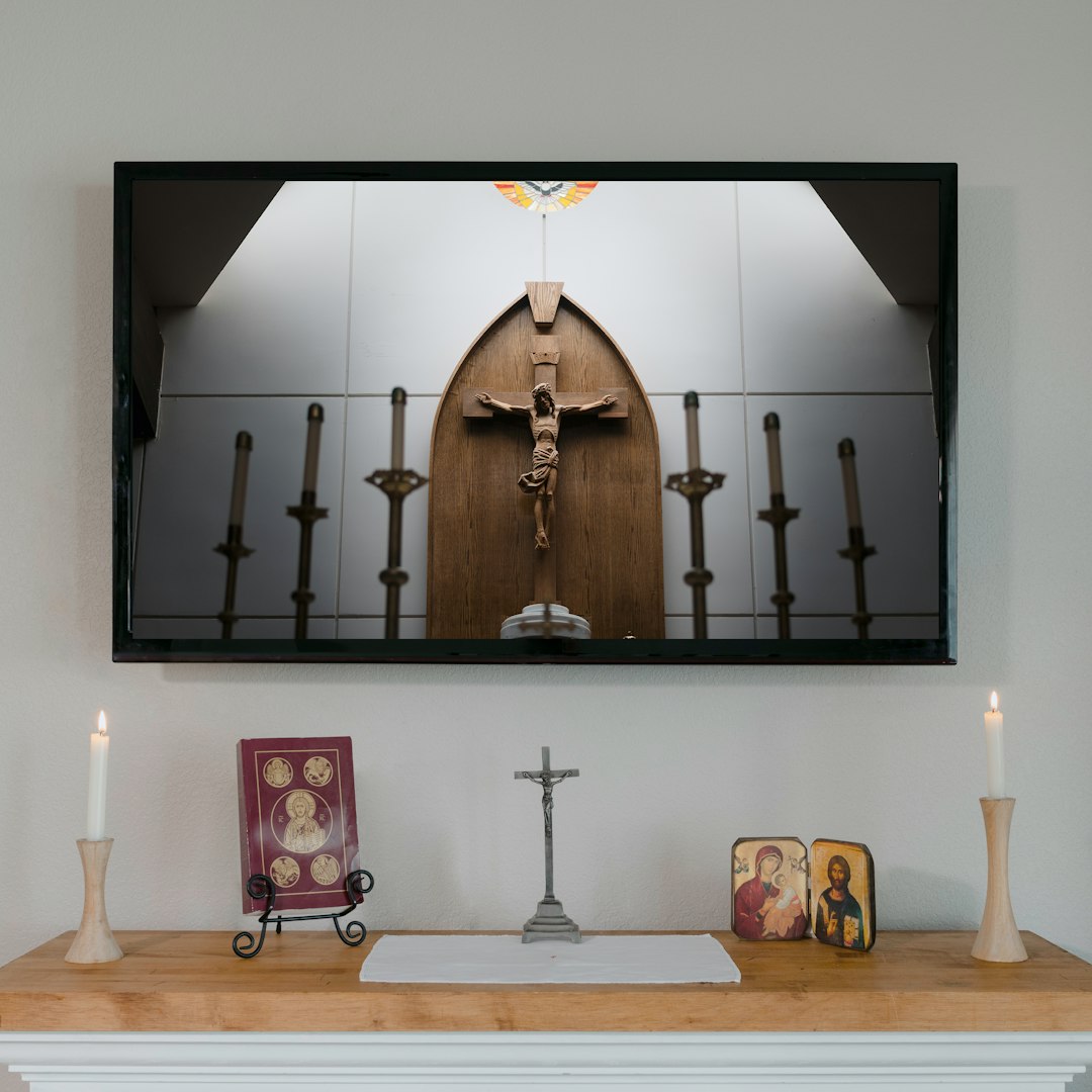 brown wooden cross on brown wooden table