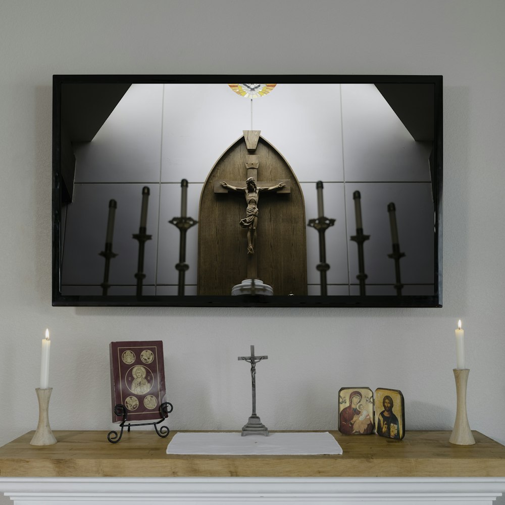 brown wooden cross on brown wooden table