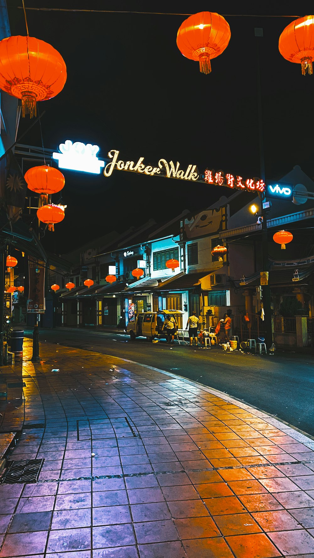 people walking on street during night time