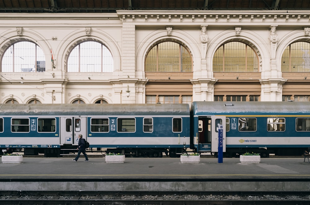 blue and white train in train station